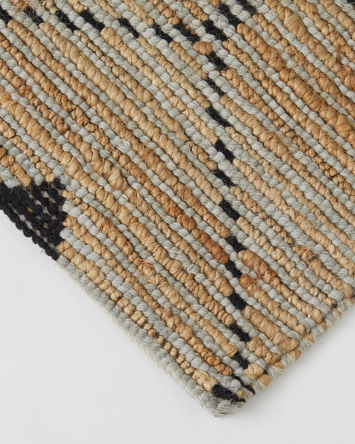 Denali Sandstorm - Weave This beautiful Denali rug boasts a unique hand-woven aesthetic and a repetitive diamond pattern. Its elegant design is versatile and complements striking furniture and metallic accents. Made from a combination of 50% wool and 50%