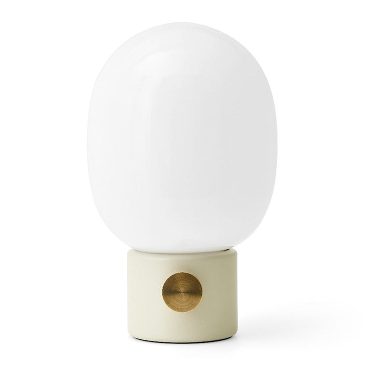 Audo CPH JWDA Table Lamp by Audo Copenhagen - The JWDA Lamp is an immediate statement piece, combining sculptural appeal with room-transforming presence. Its design features a striking balance between the fragile, curved glass and the robust metal base, c