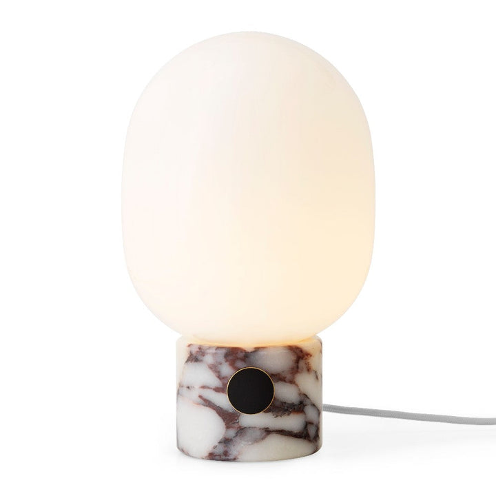 Audo CPH JWDA Table Lamp, Marble by Audo Copenhagen - An instant classic, the JWDA Lamp is the kind of sculptural piece that turns heads and brings new life to a room. The contrast of the delicate, rounded glass with the sturdy metal base makes for a bala