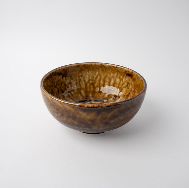 Artisan 19cm amber glaze bowl with unique texture and color variations, perfect for serving or décor.