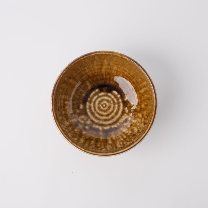 19cm amber glaze bowl showcasing artisan texture and slight irregularities, perfect for dining or serving.