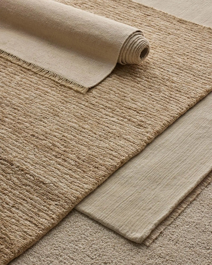 Emilio Canvas - Premium Linen Rug for Your Home Emilio Canvas is a light beige-cream rug that adds natural elegance and charm to any space with its refined design.