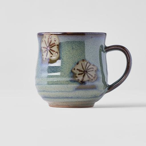 Handcrafted green mug with leaf design, 225ml capacity, showcasing artisan glaze and texture.