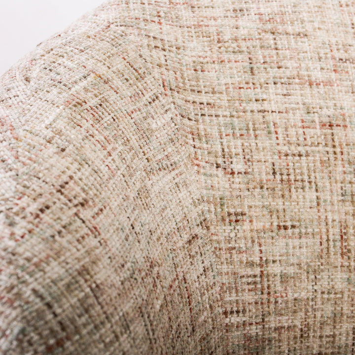 Aslan Occasional Chair Tawny The Aslan Occasional Chair invites you to sink into plush comfort with its curved silhouette and soft, textured upholstery. This chair introduces a vibrant, multi-coloured fabric that adds bold personality while maintaining a