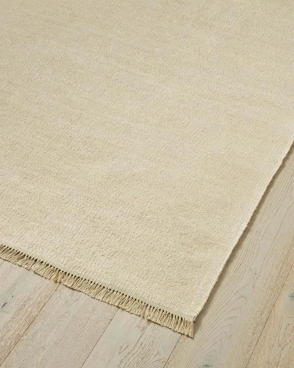 Emilio Canvas - Premium Linen Rug for Your Home Emilio Canvas is a light beige-cream rug that adds natural elegance and charm to any space with its refined design.