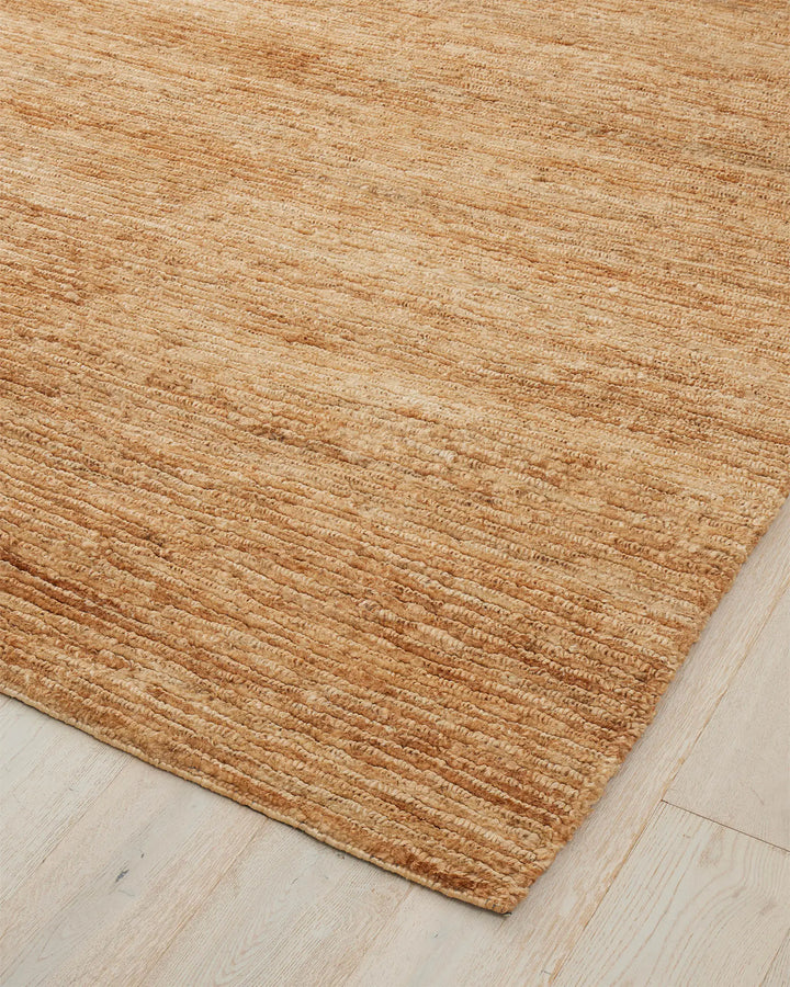 Bastian Natural - Handcrafted Jute Rug Bastian Natural offers a unique, durable jute rug combining artistry and craftsmanship for a rich tactile experience in your space.
