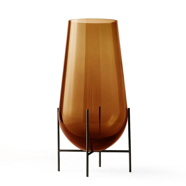 Audo CPH Echasse Vase - Small by Audo Copenhagen - The Échasse Collection offers a fresh take on the timeless sophistication of glass vases and bowls, featuring a minimalist design with a refined yet whimsical character suited to both contemporary and cla