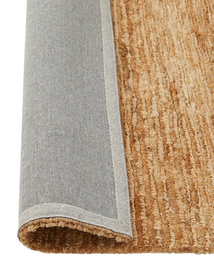 Bastian Natural - Handcrafted Jute Rug Bastian Natural offers a unique, durable jute rug combining artistry and craftsmanship for a rich tactile experience in your space.