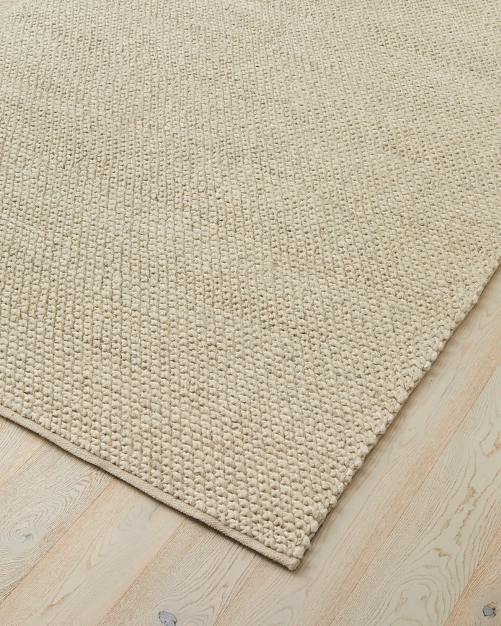 Emerson Seasalt - Luxurious Thick Rug Emerson Seasalt offers a soft, textured rug in a warm off-white tone, perfect for bedrooms and more with a durable cotton backing.