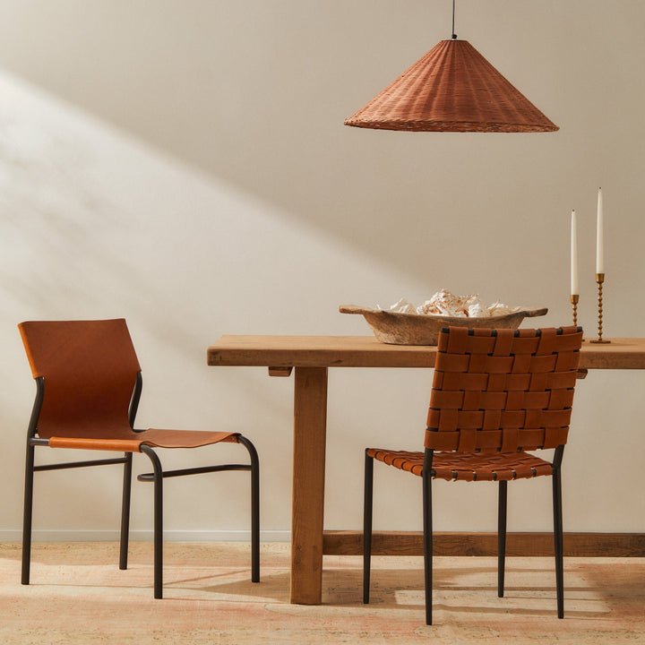 Batali Dining Chair Tan featuring woven leather strapping and metal frame in a modern dining setting.