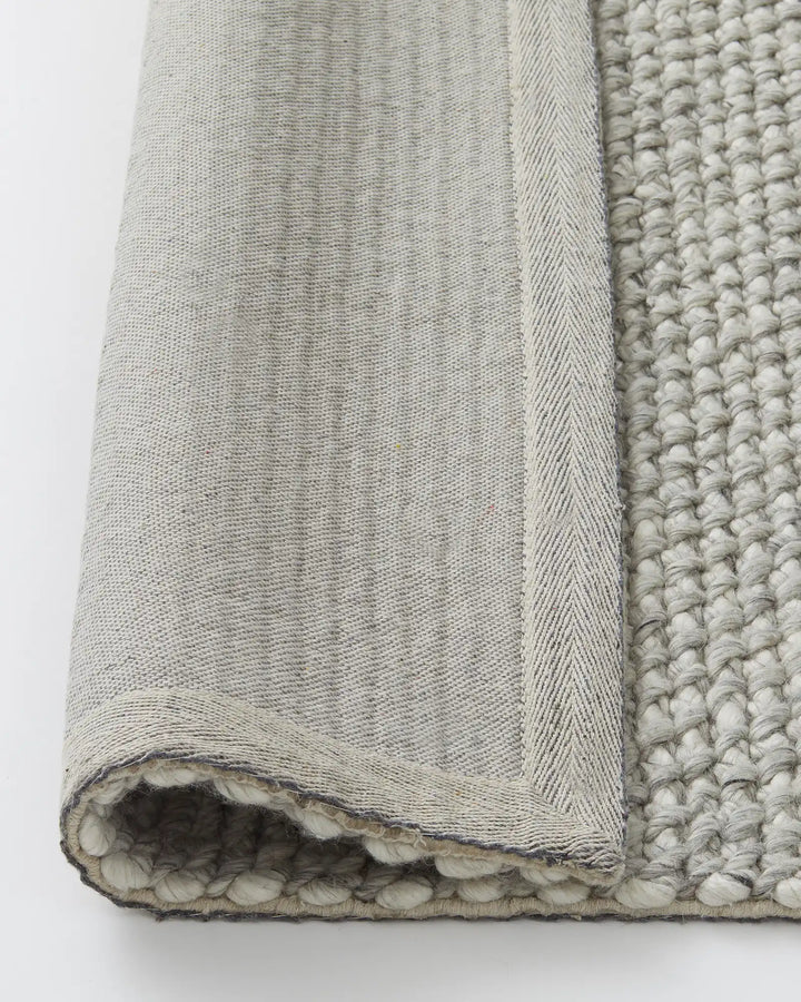 Emerson Feather - Hand-Woven Floor Rug Discover the Emerson Feather rug, a soft and textured piece made from wool and viscose, perfect for any space.