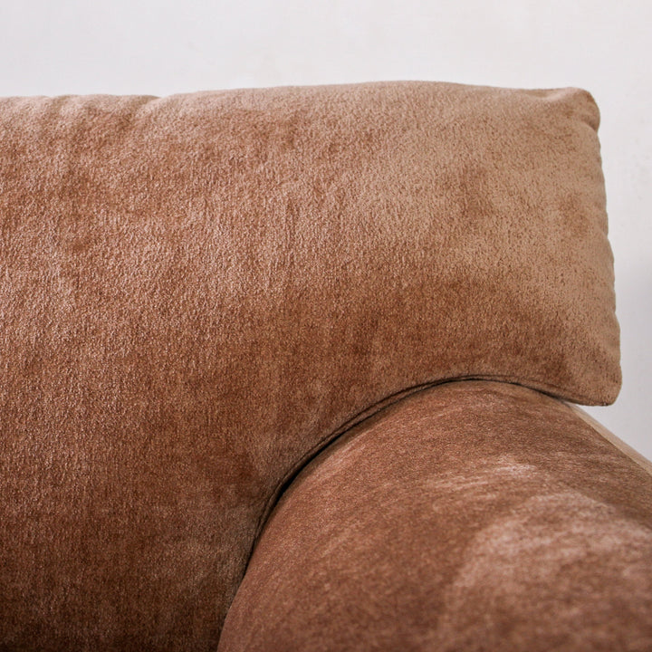 Alfie Single Seater Chai With soft lines and rich textures, our Alfie Single Seater in Chai Velvet is a gentle, sculptural piece designed to ground your space. As part of the Tender Forms collection, it embraces a cocoon-like silhouette, fold-over armrest