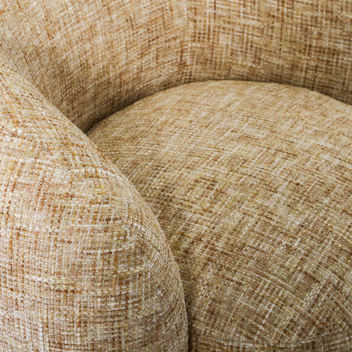 Aslan Occasional Chair Honey The Aslan Occasional Chair invites you to sink into plush comfort with its curved silhouette and soft, textured upholstery. This chair introduces a vibrant, multi-coloured fabric that adds bold personality while maintaining a