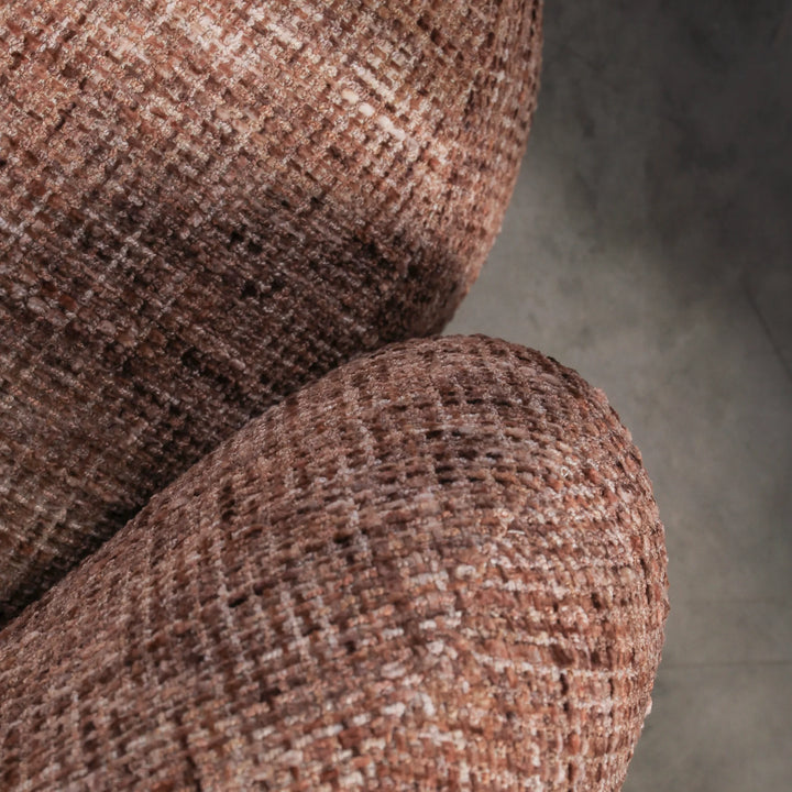 Aslan Occasional Chair Rust The Aslan Occasional Chair invites you to sink into plush comfort with its curved silhouette and soft, textured upholstery. This chair introduces a vibrant, multi-coloured fabric that adds bold personality while maintaining a r