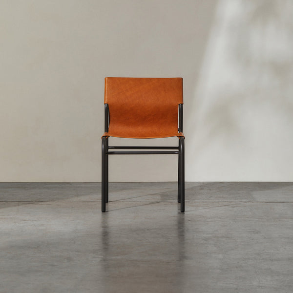 Fieri Dining Chair Tan featuring minimalist metal frame and warm tan leather seat.