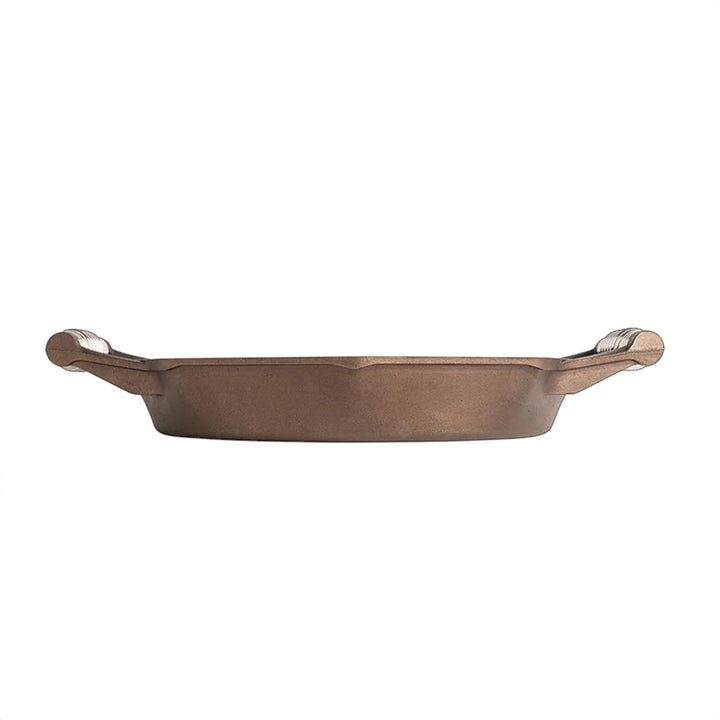 FINEX cast iron skillet featuring patented octagonal design and polished cooking surface for effortless food release.