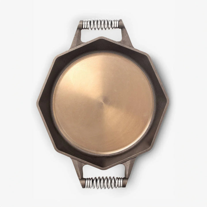 Top view of FINEX cast iron skillet with octagonal shape and polished cooking surface.