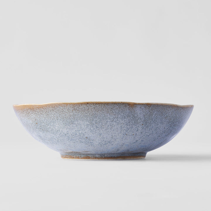 Oval 19cm bowl in steel grey glaze with soft blue tone and earthy brown edges, featuring a unique organic shape.