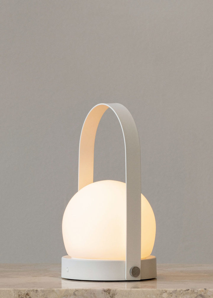 AUDO CPH (ex MENU) Carrie Lamp Portable + Rechargeable, White by Audo Copenhagen - A minimalist innovation for freedom and flexibility, the Carrie Table Lamp, portable with a metal base and glass shade is unique for its multiple uses and mutability. Usefu