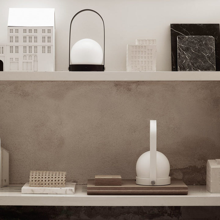 AUDO CPH (ex MENU) Carrie Lamp Portable + Rechargeable, Olive by Audo Copenhagen - A minimalist innovation for freedom and flexibility, the Carrie Table Lamp, portable with a metal base and glass shade is unique for its multiple uses and mutability. Usefu