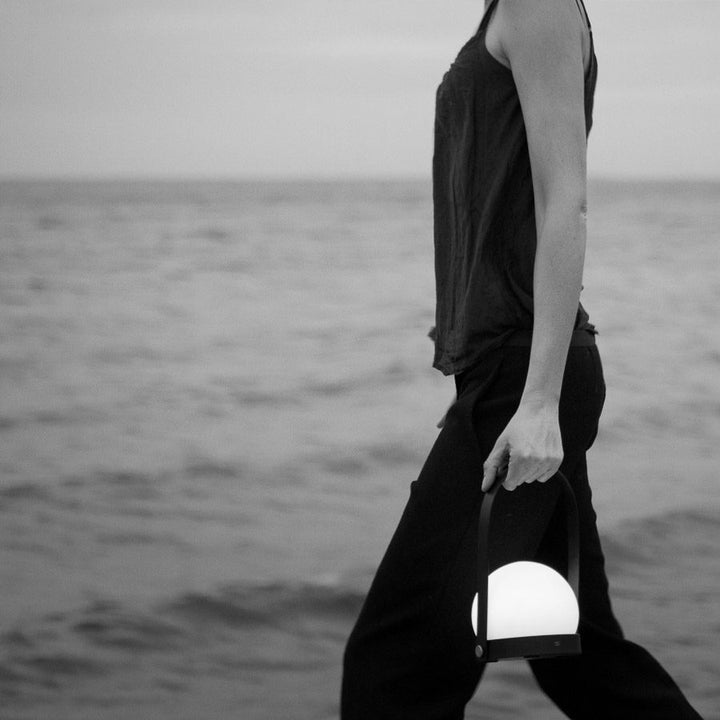 AUDO CPH (ex MENU) Carrie Lamp Portable + Rechargeable, Olive by Audo Copenhagen - A minimalist innovation for freedom and flexibility, the Carrie Table Lamp, portable with a metal base and glass shade is unique for its multiple uses and mutability. Usefu