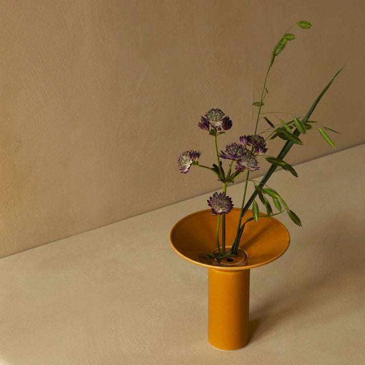 Audo CPH Hana Vase (Height 14.5 cm), Ochre by Audo Copenhagen - Product Information:Hana is inspired by ikebana, the ancient Japanese art of flower arranging that uses few but carefully chosen and artfully positioned stems. Shaped around a central ceramic