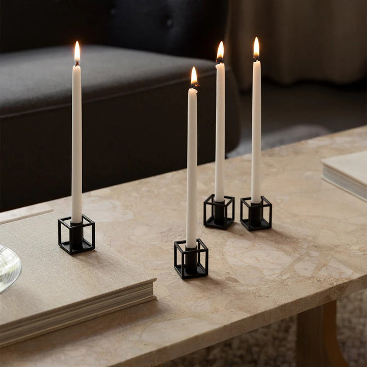 Audo CPH Kubus Micro, Candle Holder, Black (2 pcs.) by Audo Copenhagen - Product Information:Kubus Micro is a stylish and slight version of the first Kubus candle holder Mogens Lassen designed in 1962. Profiling the same geometry as its predecessor on a s