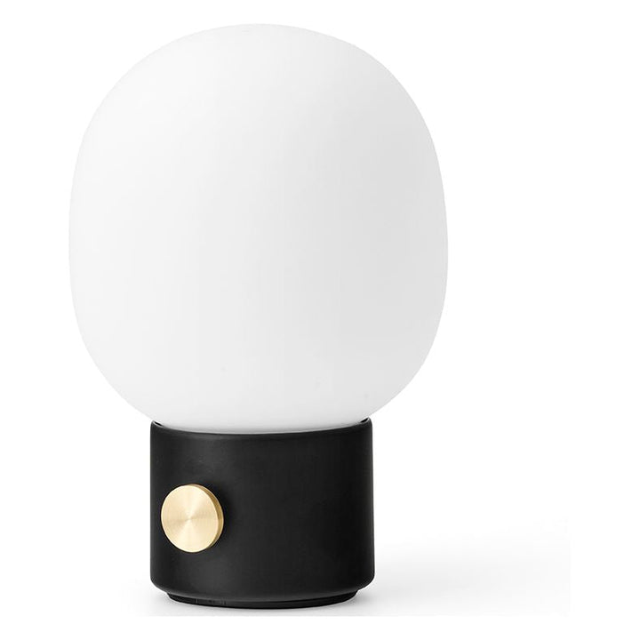 JWDA Portable Table Lamp by Audo Copenhagen - An instant classic, the JWDA Lamp is the kind of sculptural piece that turns heads and brings new life to a room. The contrast of the delicate, rounded glass with the sturdy metal base makes for a balanced and