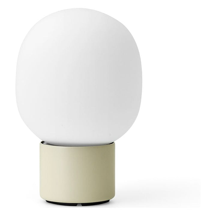 JWDA Portable Table Lamp by Audo Copenhagen - An instant classic, the JWDA Lamp is the kind of sculptural piece that turns heads and brings new life to a room. The contrast of the delicate, rounded glass with the sturdy metal base makes for a balanced and