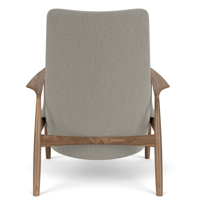 The Seal High Back Lounge Chair by Audo Copenhagen - Arguably one of Ib Kofod-Larsen's best-known designs, The Seal is an elegant armchair typical of its time – and yet entirely timeless. The angled frame and armrests and leather upholstery put comfort at