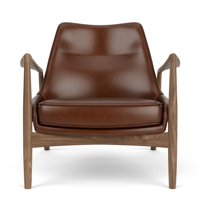The Seal Low Back Lounge Chair by Audo Copenhagen - Arguably one of Ib Kofod-Larsen's best-known designs, The Seal is an elegant armchair typical of its time – and yet entirely timeless. The angled frame and armrests and leather upholstery put comfort at