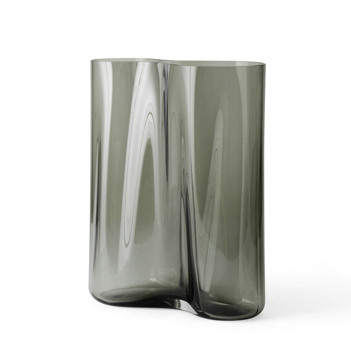Audo CPH Aer Vase 33 by Audo Copenhagen - Drawing inspiration from the swirling flow of air seen in smoke or mist, Gabriel Tan’s Aer vase for Audo CPH introduces a sculptural elegance to any setting. Named after the Latin term for air or vapor, its asymme