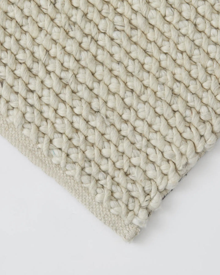 Emerson Seasalt - Luxurious Thick Rug Emerson Seasalt offers a soft, textured rug in a warm off-white tone, perfect for bedrooms and more with a durable cotton backing.