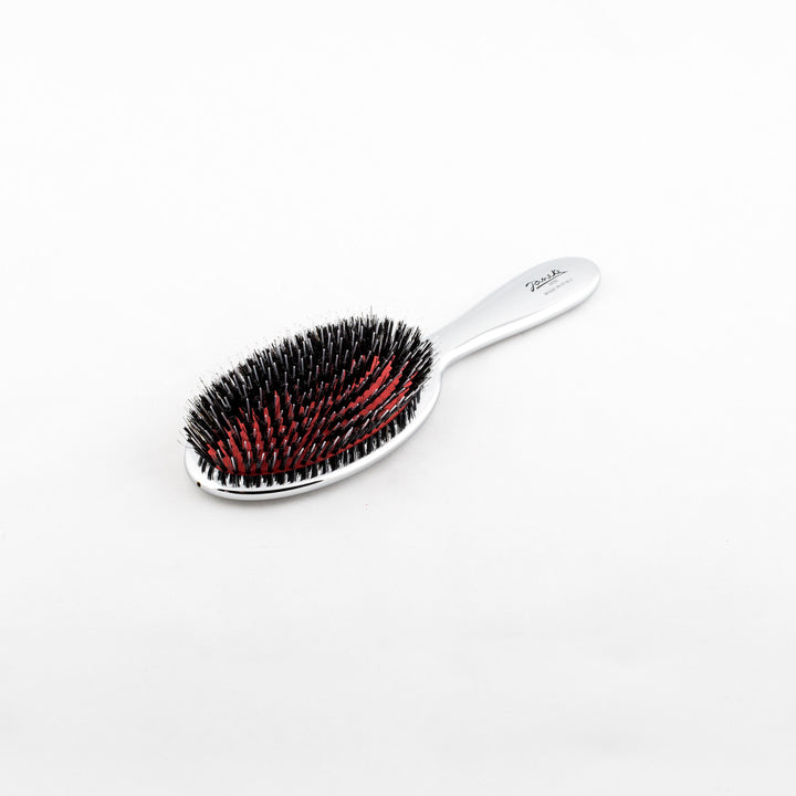 Janeke Silver Nylon/Boar Bristle Hairbrush - 3 Sizes This hairbrush combines both shine and detangling abilities with its unique blend of nylon and boar bristles. It effectively distributes the natural oils from your scalp to the ends of your hair, while