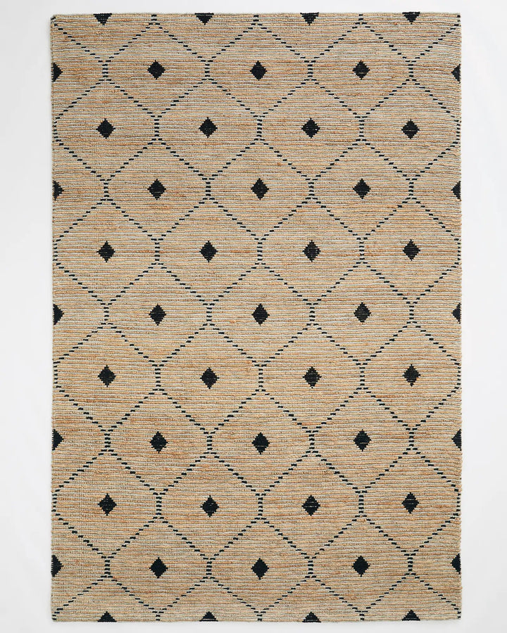 Denali Sandstorm - Weave This beautiful Denali rug boasts a unique hand-woven aesthetic and a repetitive diamond pattern. Its elegant design is versatile and complements striking furniture and metallic accents. Made from a combination of 50% wool and 50%
