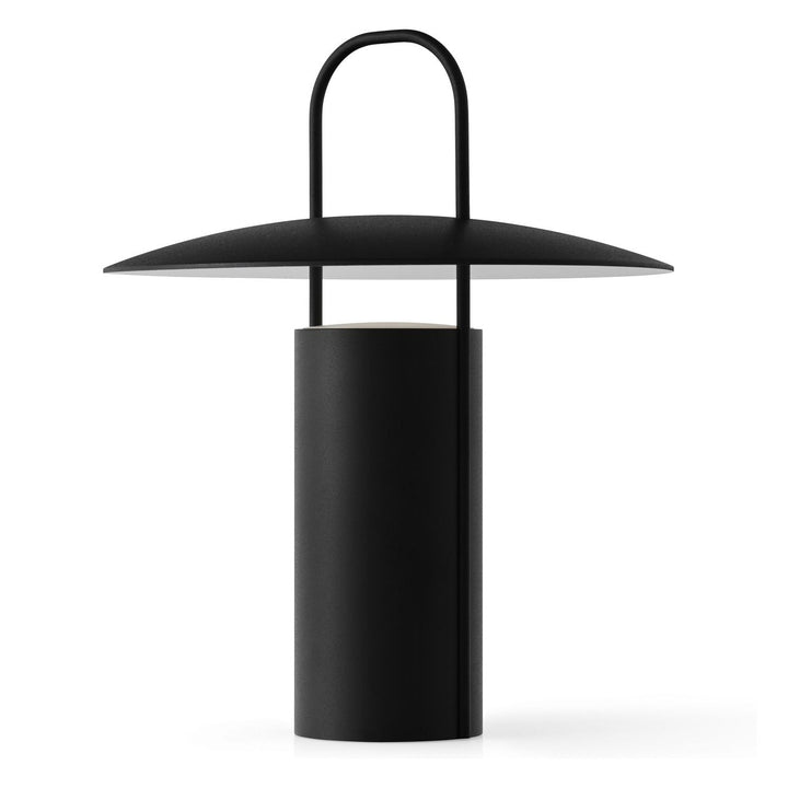 Ray Portable Table Lamp by Audo Copenhagen - Daniel Schofield’s Ray Table Lamp for MENU has a distinctive silhouette inspired by old mining lamps. Its simplified design in powder-coated metal and glass features a practical top handle that makes it easy to