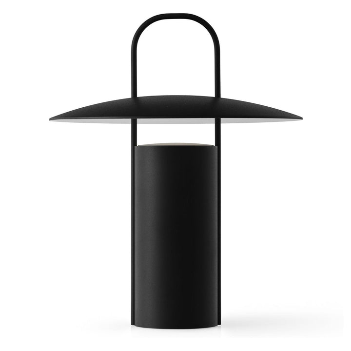 Ray Portable Table Lamp by Audo Copenhagen - Daniel Schofield’s Ray Table Lamp for MENU has a distinctive silhouette inspired by old mining lamps. Its simplified design in powder-coated metal and glass features a practical top handle that makes it easy to