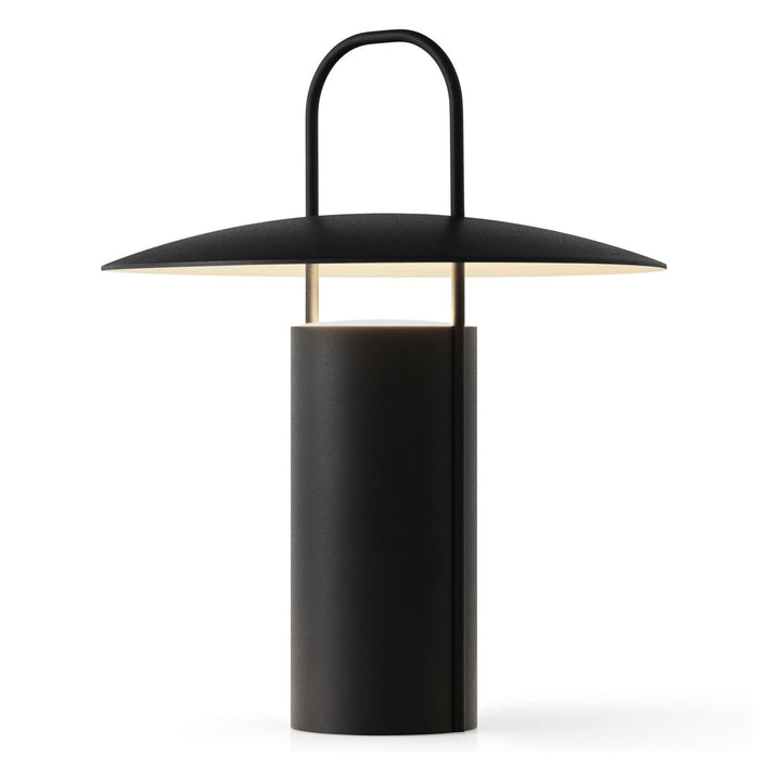 Ray Portable Table Lamp by Audo Copenhagen - Daniel Schofield’s Ray Table Lamp for MENU has a distinctive silhouette inspired by old mining lamps. Its simplified design in powder-coated metal and glass features a practical top handle that makes it easy to