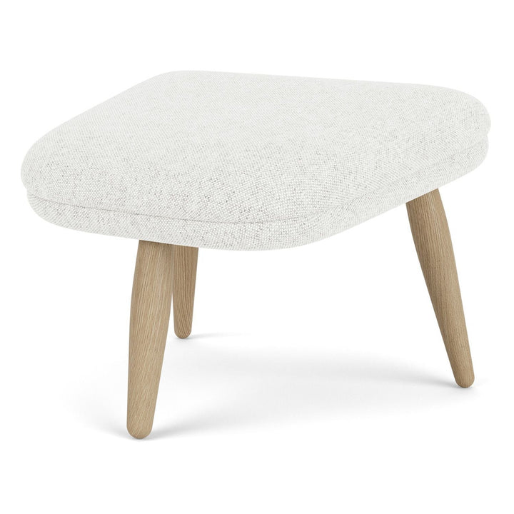 Oda Ottoman by Audo Copenhagen - Designed for use with Arnold Madsen’s Oda Chair but equally purposeful alone, the Oda Ottoman profiles the same careful craft and embracing form, shaped to offer comfortable support when seated. Constructed according to a