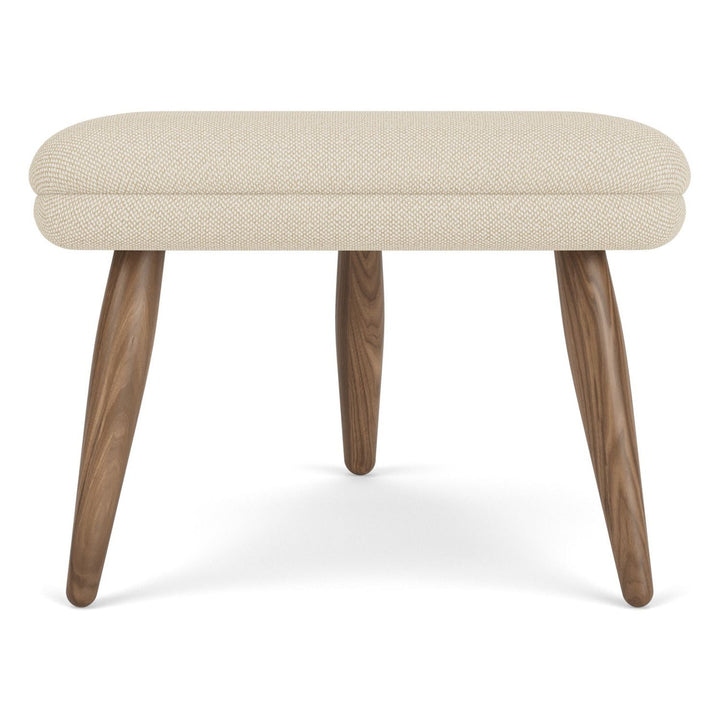 Oda Ottoman by Audo Copenhagen - Designed for use with Arnold Madsen’s Oda Chair but equally purposeful alone, the Oda Ottoman profiles the same careful craft and embracing form, shaped to offer comfortable support when seated. Constructed according to a