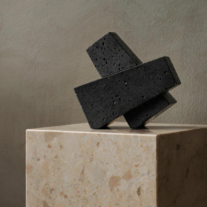 AUDO CPH (ex MENU) Converge Book Ends, Lava Stone by Audo Copenhagen - Designed to hold books in place, the abstract forms of the Converge bookends are shaped from lava stone – A dark and porous material with a textured surface. Use as intended, one at ei