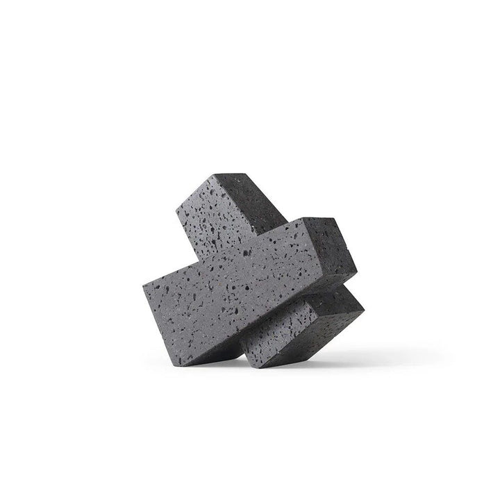 AUDO CPH (ex MENU) Converge Book Ends, Lava Stone by Audo Copenhagen - Designed to hold books in place, the abstract forms of the Converge bookends are shaped from lava stone – A dark and porous material with a textured surface. Use as intended, one at ei