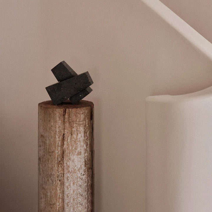 AUDO CPH (ex MENU) Converge Book Ends, Lava Stone by Audo Copenhagen - Designed to hold books in place, the abstract forms of the Converge bookends are shaped from lava stone – A dark and porous material with a textured surface. Use as intended, one at ei