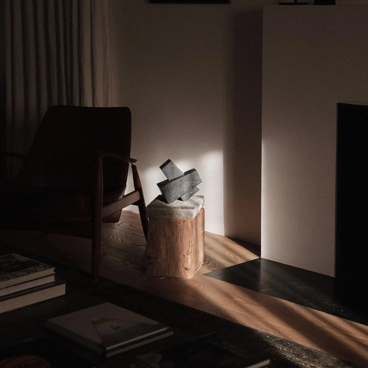 AUDO CPH (ex MENU) Converge Book Ends, Lava Stone by Audo Copenhagen - Designed to hold books in place, the abstract forms of the Converge bookends are shaped from lava stone – A dark and porous material with a textured surface. Use as intended, one at ei