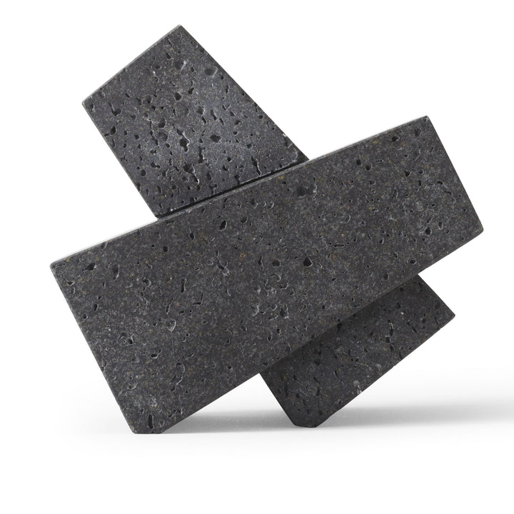 Converge Bookend by Audo Copenhagen - Designed to neatly hold books in place, the abstract forms of the Converge Bookends are shaped from lava stone – a dark and porous material with a textured surface. Use as intended, one at either side of a line of boo