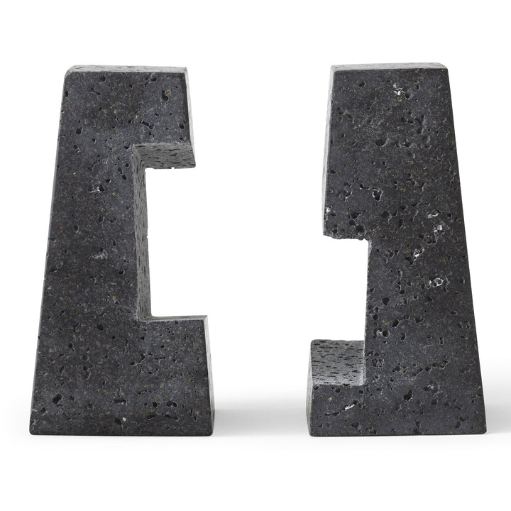Converge Bookend by Audo Copenhagen - Designed to neatly hold books in place, the abstract forms of the Converge Bookends are shaped from lava stone – a dark and porous material with a textured surface. Use as intended, one at either side of a line of boo