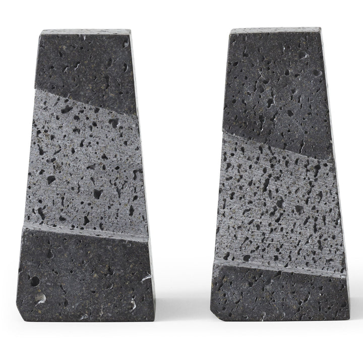 Converge Bookend by Audo Copenhagen - Designed to neatly hold books in place, the abstract forms of the Converge Bookends are shaped from lava stone – a dark and porous material with a textured surface. Use as intended, one at either side of a line of boo