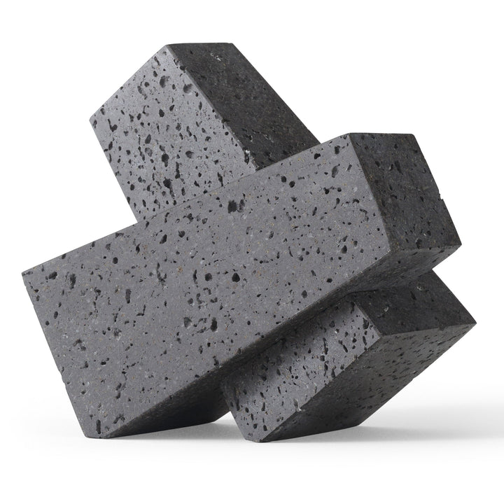 Converge Bookend by Audo Copenhagen - Designed to neatly hold books in place, the abstract forms of the Converge Bookends are shaped from lava stone – a dark and porous material with a textured surface. Use as intended, one at either side of a line of boo
