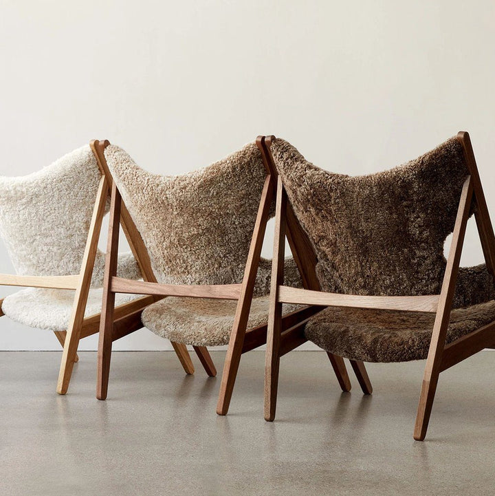 AUDO CPH Knitting Chair - Dark Oak & Sheepskin Shop the iconic AUDO CPH Knitting Lounge Chair, handcrafted in Sweden with luxe sheepskin for supreme comfort & elegance. by Audo Copenhagen Available at beon.com.au | Australian Stock