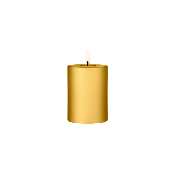 Ester & Erik LED Pillar Candle in gold with lifelike glow, perfect for elegant home decor and special events.